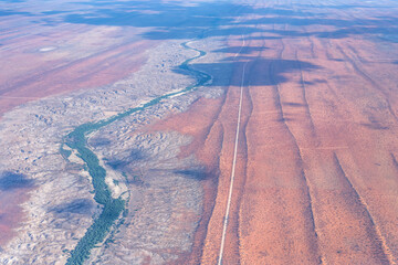 worn banks of Nossob river and red sand sunes in Kalahari desert, south of Leonardville, Namibia