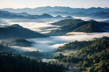Fototapeta premium Aerial view of mountains under mist morning