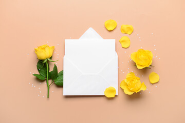 Envelope with blank card and rose flowers on beige background. International Women's Day celebration
