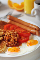 Traditional British breakfast with sausages and beans	