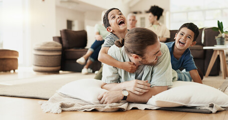 Funny, playing and father with children on floor in home living room laughing at comedy, joke or...