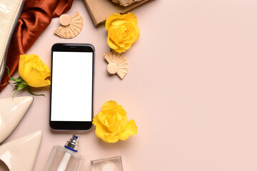 Composition with modern mobile phone, stylish female accessories and rose flowers on color background