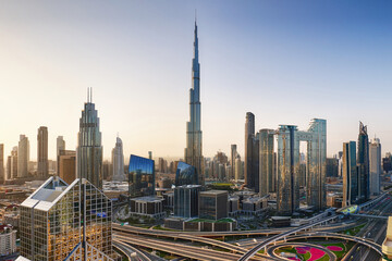 Dramatic sunrise over Dubai skyline panorama with Burj Khalifa and luxury skyscrapers, United Arab Emirates