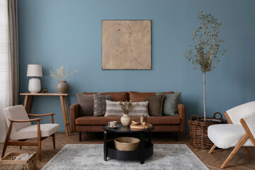 Creative composition of rural style living room interior with brown sofa, armchair, mock up...