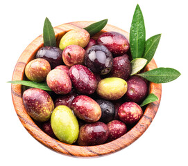 Colorful semi-ripe and ripe olives in wooden bowl isolated on white background. Top view.