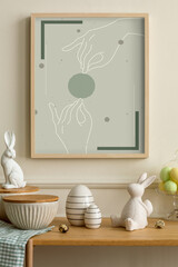 Minimalist composition of easter living room interior with mock up poster frame, wooden sideboard, easter bunny, stylish bowl, colorful easter eggs and personal accessories. Home decor. Template.