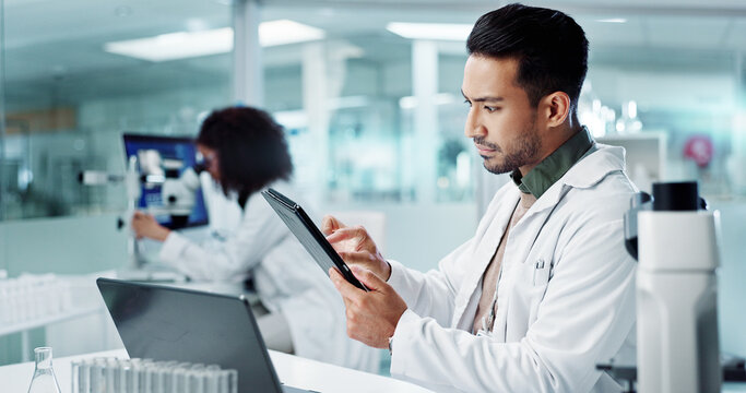 Scientist, man and tablet for laboratory research, DNA analysis and results in medical study at night. Young science expert or people in biotechnology, digital software or computer for test checklist - Powered by Adobe