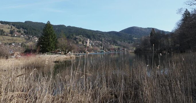 Landscapes of the Bavarian Alps. Schliersee in Upper Bavaria. On the banks of the Schlierach river bordered by a reed bed between Freudenberg and the Schliersee beach