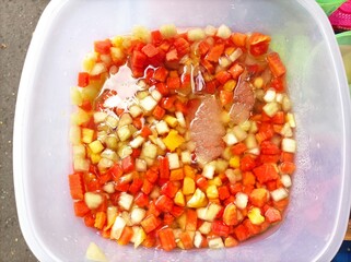 one of the snacks is fresh fruit ice consisting of various kinds of fruit and colorful which makes fruit ice very attractive. Placed in a large jar, topped with ice cubes to make it cold and fresh