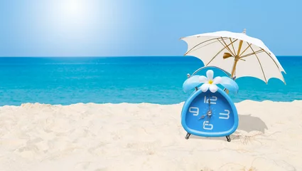 Zelfklevend Fotobehang Classic style blue alarm clock with plumeria flower and white beach umbrella with space on blurred tropical beach background, summer outdoor day light, holiday and vacation time © sirirak