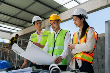 team engineer, foreman, architect meeting for colleagues discussing and checks construction blueprints at onsite