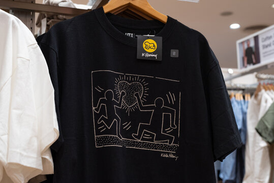 Black Uniqlo T-shirt with print of Keith Haring drawing on February 1, 2024, in Bangkok, Thailand.