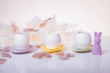 Easter-themed open eggs displayed on plates beside a purple bunny against a bright boho-style background. Suitable for Easter-themed decorations or festive greeting cards.