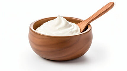 Brown ceramic bowl and wooden spoon of fresh sour cream