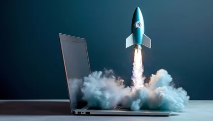 Foto op Canvas Blue rocket lifted off from a laptop on a desktop. startup concept © kilimanjaro 