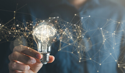 Creative solution and idea concept. Businessman and light bulb symbolizing creative idea and...