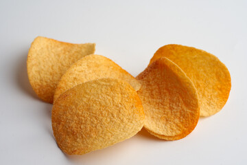 Potato chips on white background