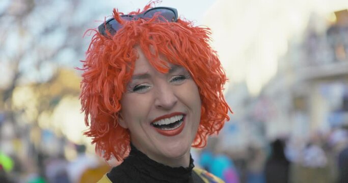 Carnival - Kiss-Kiss - Cheerful costumed woman making a kissing face and blowing a kiss. Handheld shot. Slow motion.