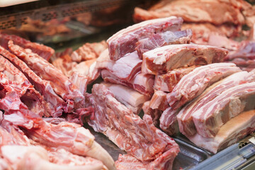Butcher shop with meat packs. Different products in meat market. Meat counter