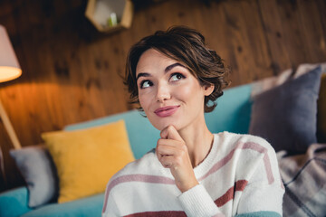Photo of pretty peaceful lady hand touch chin look interested away imagine contemplate pastime...
