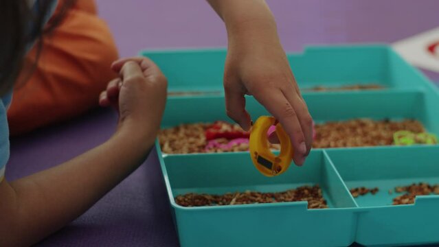 Bright learning: child, female pathologist play language games, letters fly, happy sounds in therapy. Together, growing.