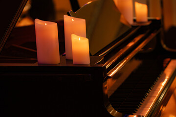 candles on classic piano for design purpose