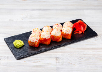 Sushi rolls baked with red caviar