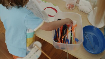 In a sunlit office, a little learner and her tutor in white coat share smiles, speech games. Joyful articulation, bonding.