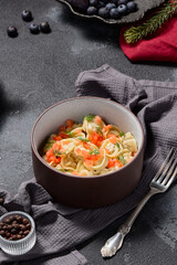 Classic meat dumplings garnished with tomato tartare and dill, winter menu aesthetic composition