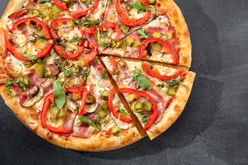 Meat lovers' pizza with bacon, ham, marinated pickles, and paprika, bursting with flavors and toppings