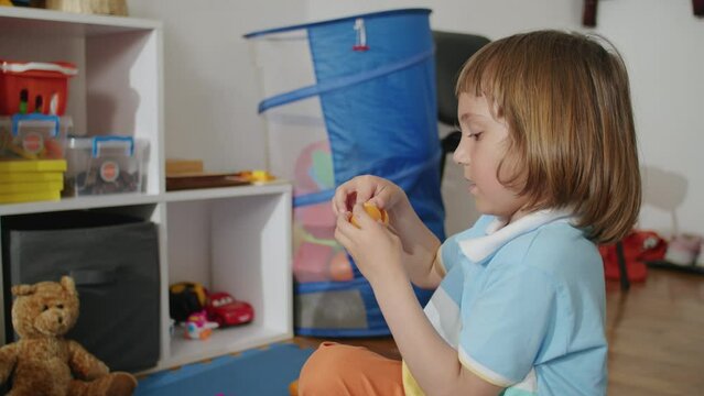 Therapy through play: joyful child, professional in white, tackling language together. Office of learning, laughter.