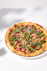 Artistic Niçoise-Style Tuna Pizza with Olives and Arugula on Shadowed White