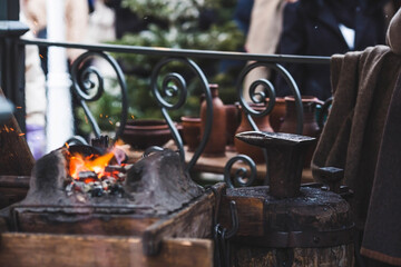 Moscow seasons. A traditional craft. Blacksmith's work with metal. Hammer and anvil. Russian...