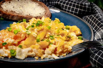 Scrambled eggs with onion and chives.