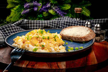 Scrambled eggs with onion and chives.
