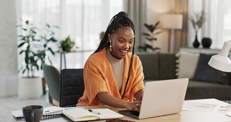 Black woman, typing in home office and laptop for research in remote work, social media or blog in...