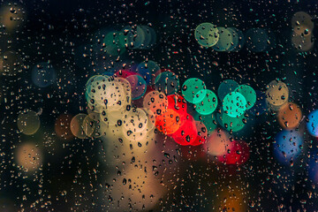 rain drops on the window surface and traffic bokeh background - 729964157