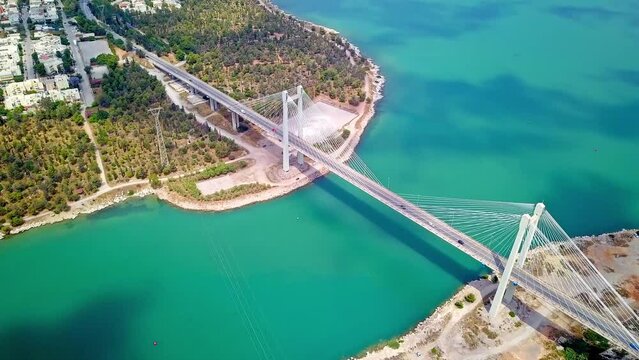 Drone aerial shot of Chalkida Bridge, an iconic landmark in Greece, the blue surface of the sea