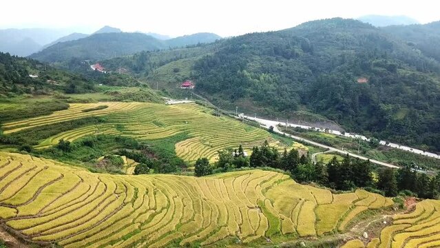 A Chinese mountain village and the harvesting terraces; each one of the stacked terraces is unique from each other.