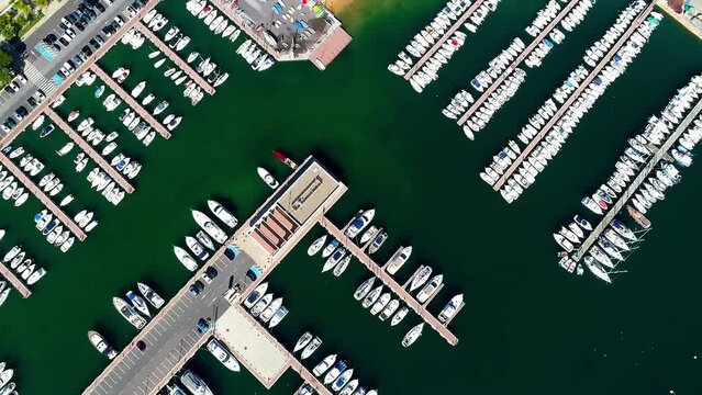 Aerial view of the white yachts parked by a Spanish coast