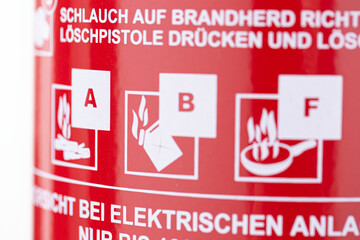 closeup of a german fire extinguisher, showing the applicable fire classes of a foam fire drencher