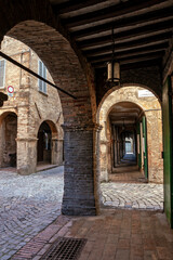 Urbania, Pesaro and Urbino district, Marche, Italy, the arcades along the Filippo Ugolini street
