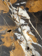 Black marble with veins. Black marble texture. Marble background