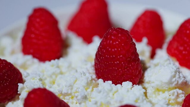 Cottage cheese with raspberry. Selective focus, horizontal. Bio organic natural ingredients. Healthy eating.