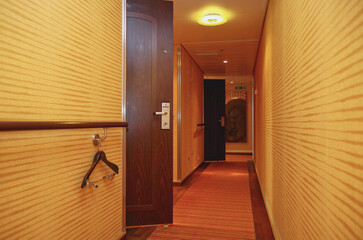 Hallway corridor aisle to suites and stateroom cabins on luxury cruiseship cruise ship liner with...