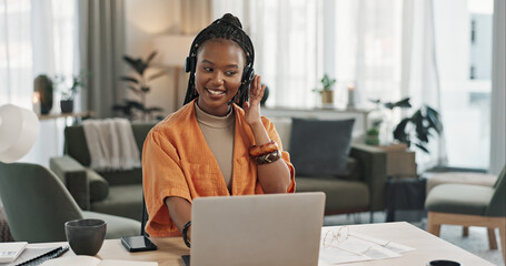 Black woman, headset in home office with laptop and phone call, remote work and crm in apartment. Virtual assistant at desk with computer, typing and conversation for advice, online chat and support