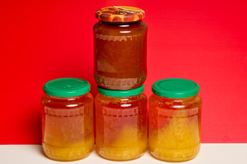Jar of natural honey made at home on a table.