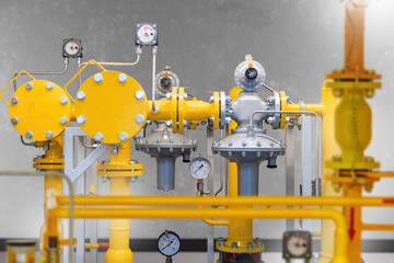 Gas equipment. Yellow pipes with mechanical manometers. Compressor equipment for gas station. Pipes...