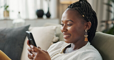Funny, smile and black woman on a couch, cellphone or connection with social media, comedy post or...