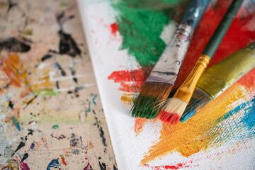 Fototapeta premium painting lessons, canvas with paints, brushes and other elements for painting